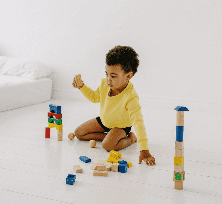 kid playing with toys